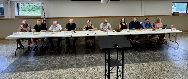 Carmi City Council members facing crowd at meeting